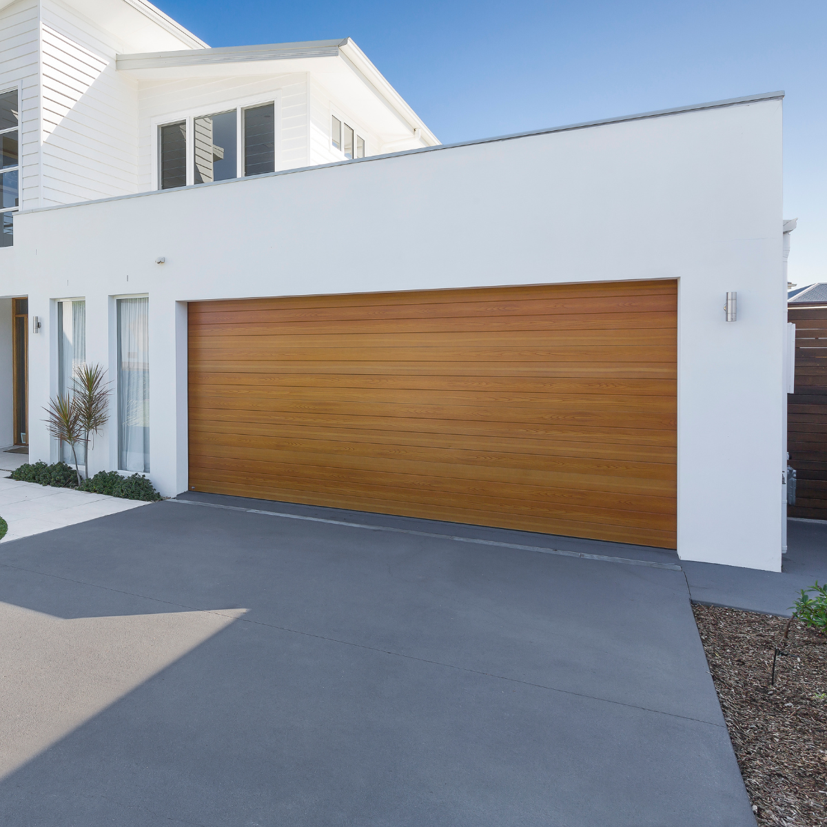 Warm timber-look sectional door reflecting product innovation